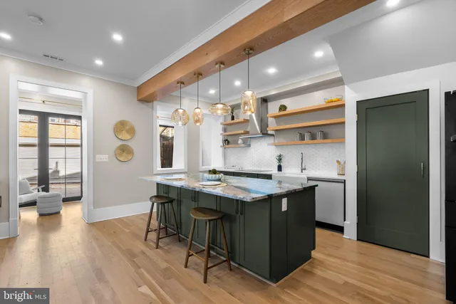 a kitchen with a refrigerator and microwave