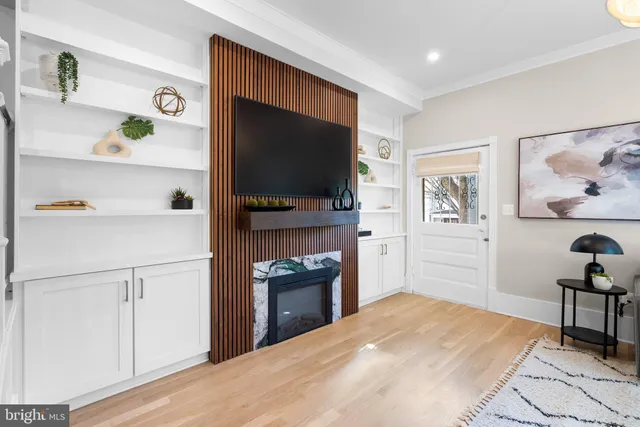 a utility room with cabinets a sink and dishwasher