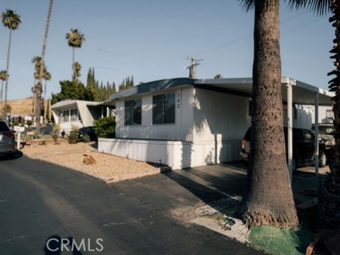 2751 South Reche Canyon Road, Unit 162 Colton, CA 92324 - Photo 1 of 11 a view of a street with houses