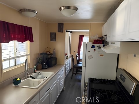 2751 South Reche Canyon Road, Unit 162 Colton, CA 92324 - Photo 3 of 11 a room with furniture a window and gym equipment