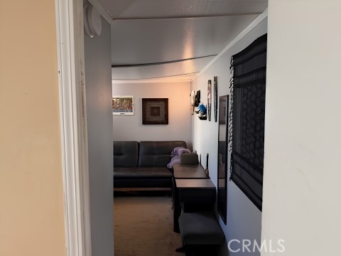 2751 South Reche Canyon Road, Unit 162 Colton, CA 92324 - Photo 5 of 11 a living room with furniture and a window