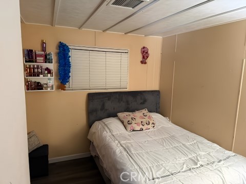 2751 South Reche Canyon Road, Unit 162 Colton, CA 92324 - Photo 7 of 11 a bedroom with a bed and a window