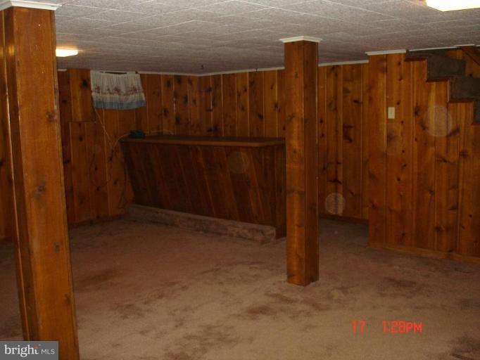 7000 Warfield Road Gaithersburg, MD 20882 - Photo 12 of 12 a view of a room with wooden walls