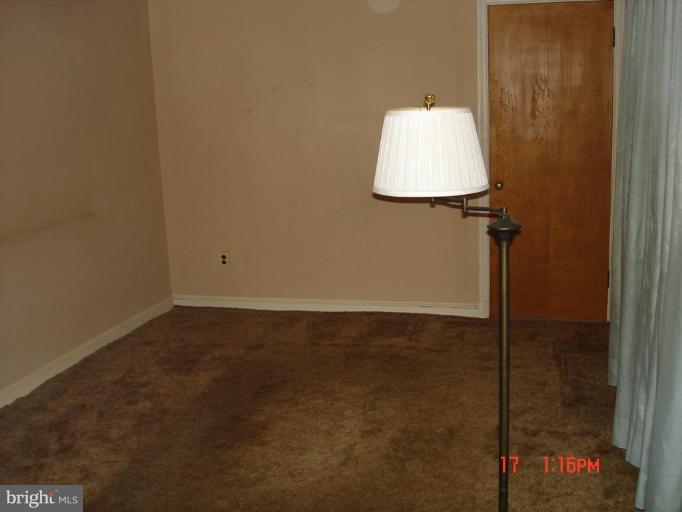 7000 Warfield Road Gaithersburg, MD 20882 - Photo 10 of 12 a bathroom with a small table and a sink
