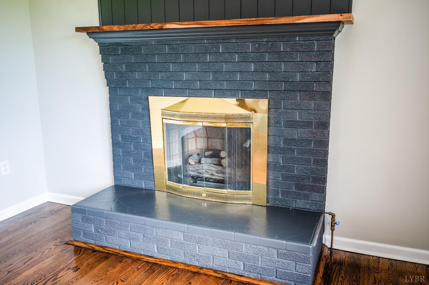 7230 Wards Road Rustburg, VA 24588 - Photo 14 of 58 a view of outdoor space with wooden floor and a fireplace
