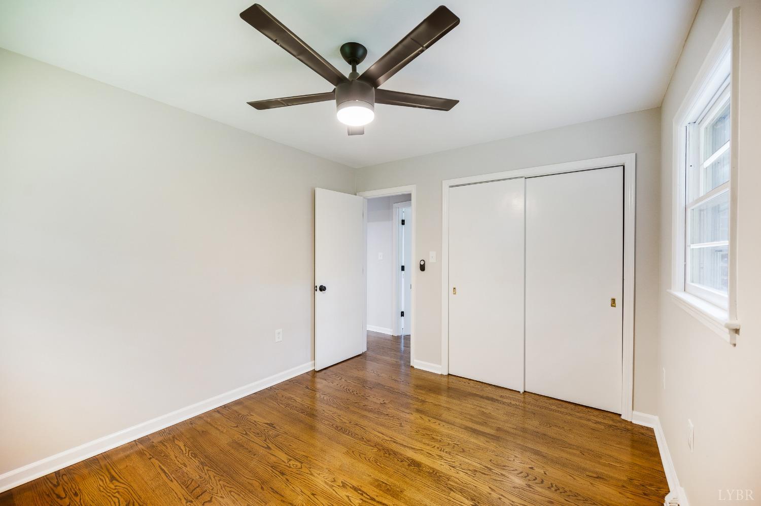 7230 Wards Road Rustburg, VA 24588 - Photo 33 of 58 a view of empty room with wooden floor