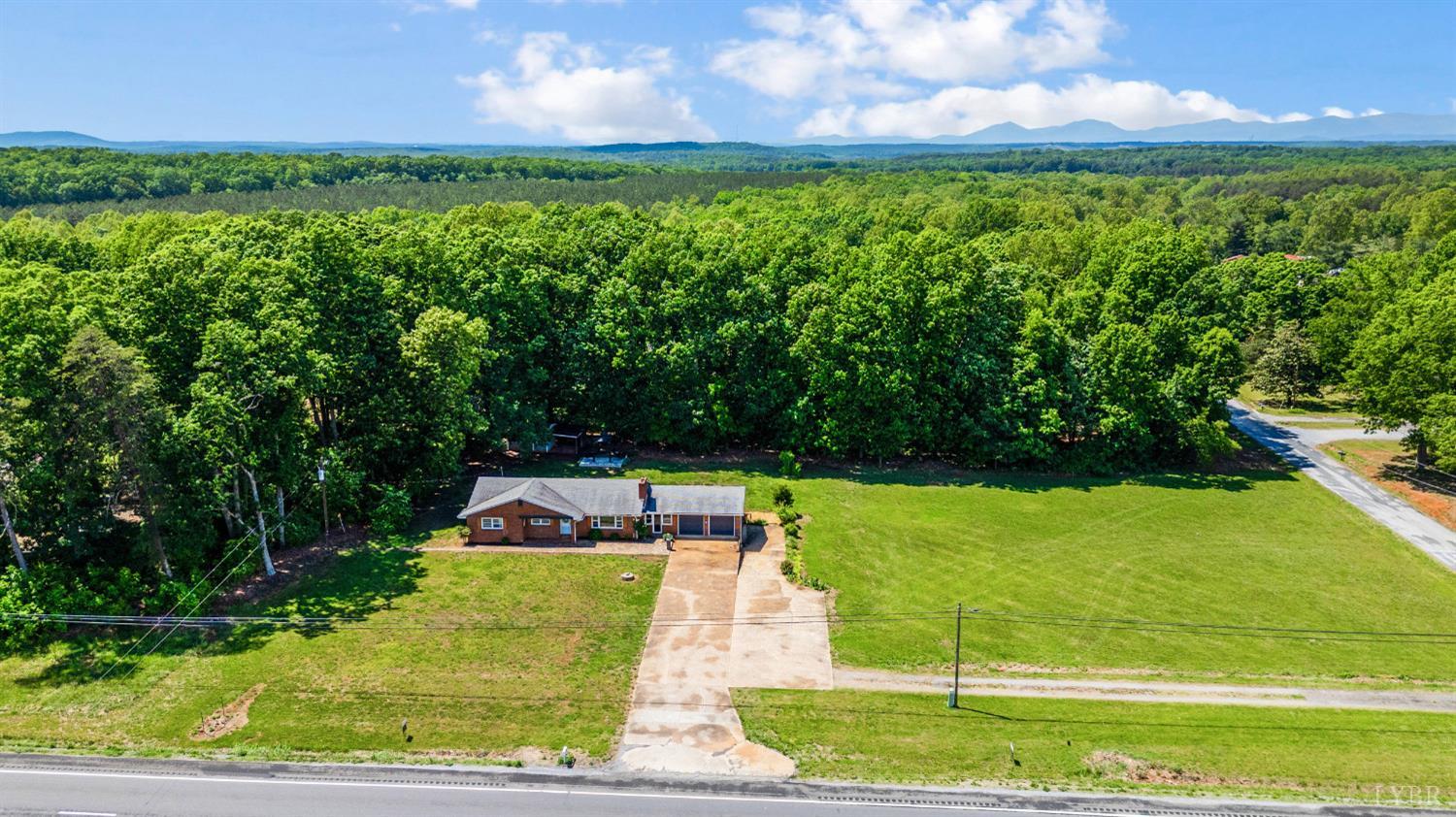 7230 Wards Road Rustburg, VA 24588 - Photo 10 of 58 a view of a golf course with a garden