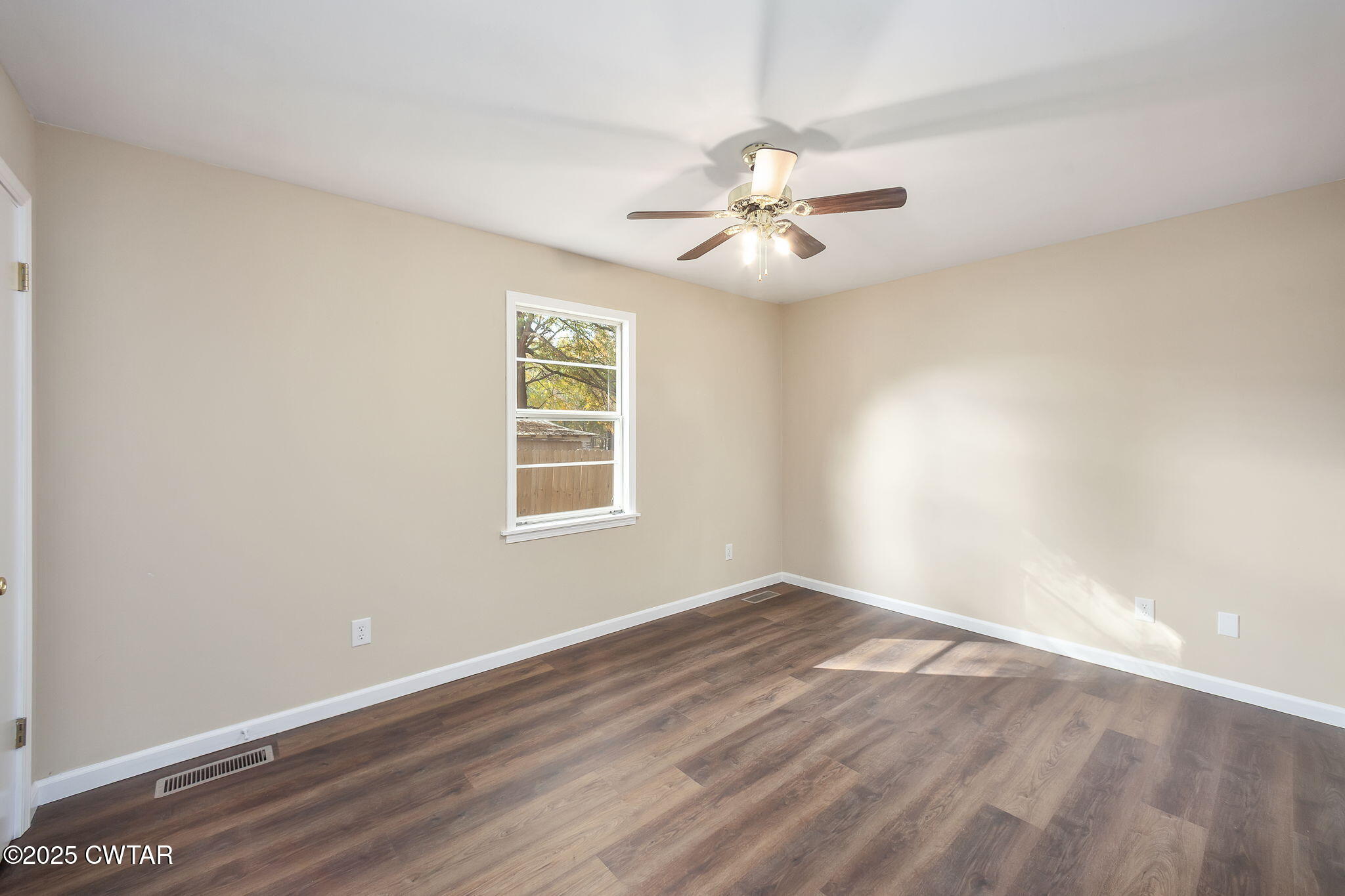 35 Misty Lane Bells, TN 38006 - Photo 12 of 23 wooden floor in an empty room with a window