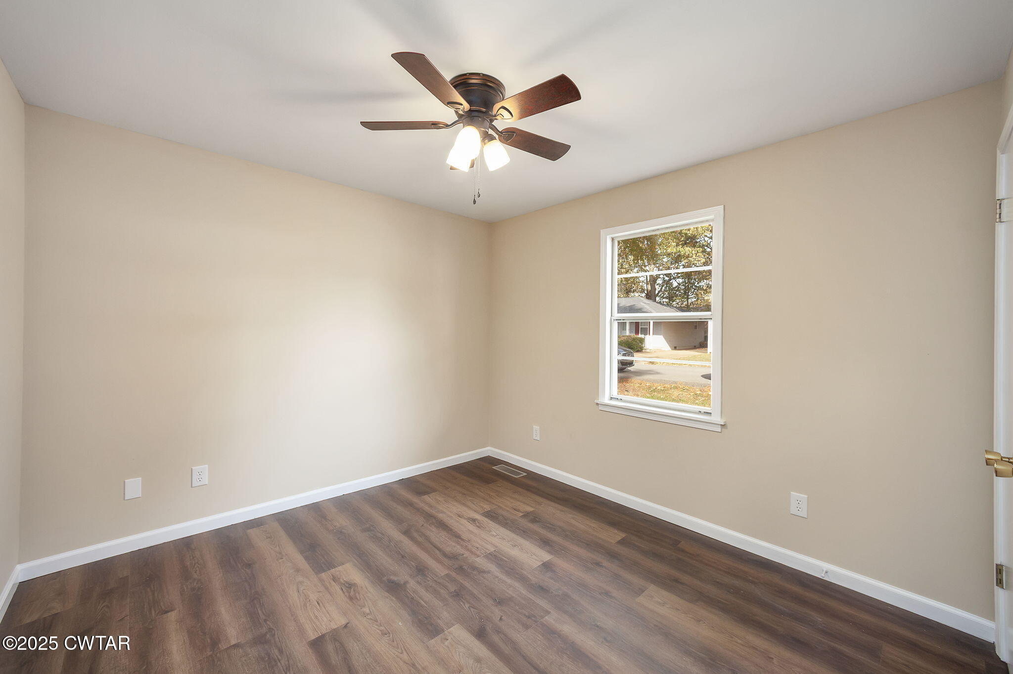 35 Misty Lane Bells, TN 38006 - Photo 16 of 23 wooden floor in an empty room with a window