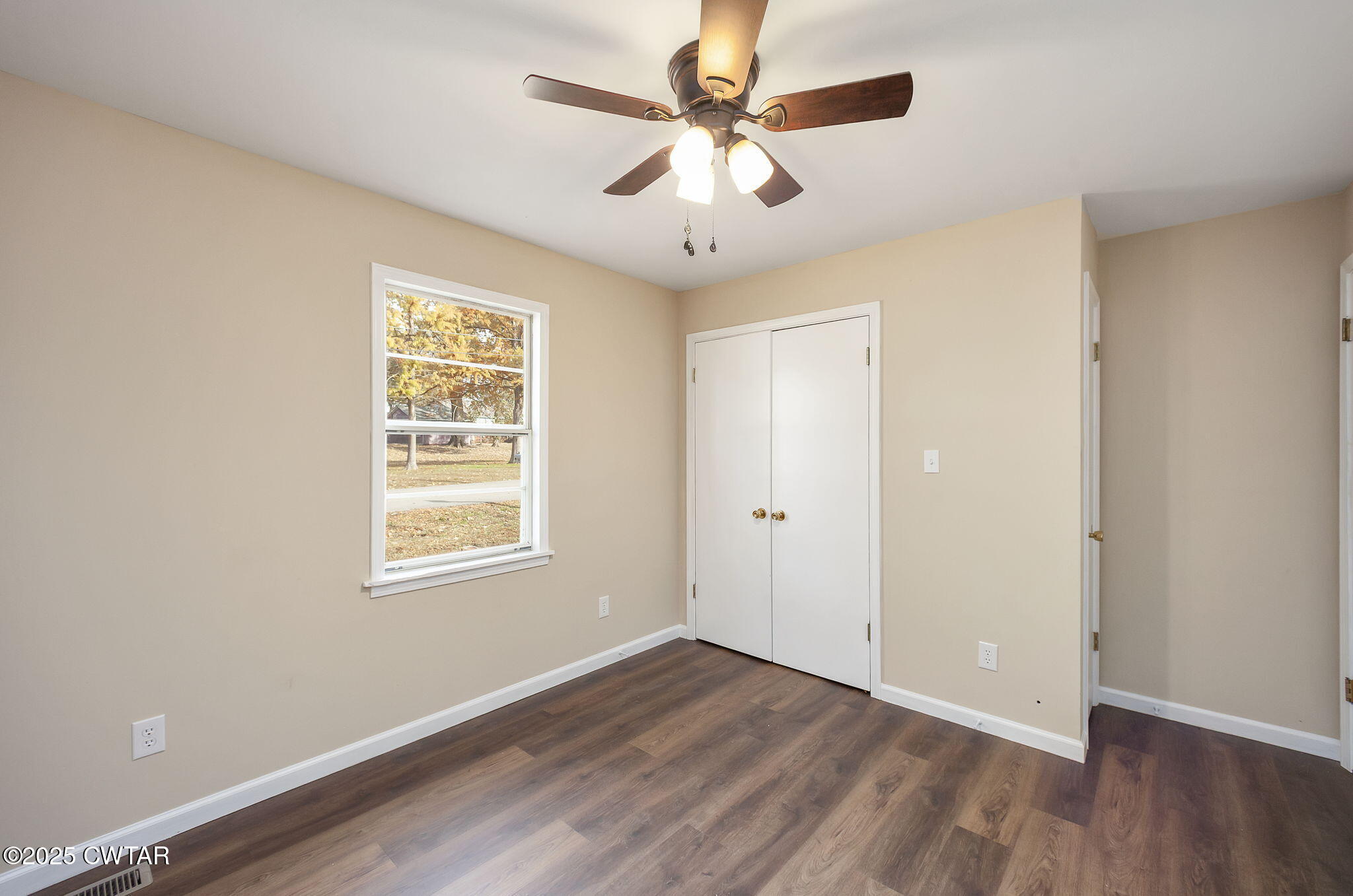 35 Misty Lane Bells, TN 38006 - Photo 17 of 23 a view of an empty room with wooden floor and a window