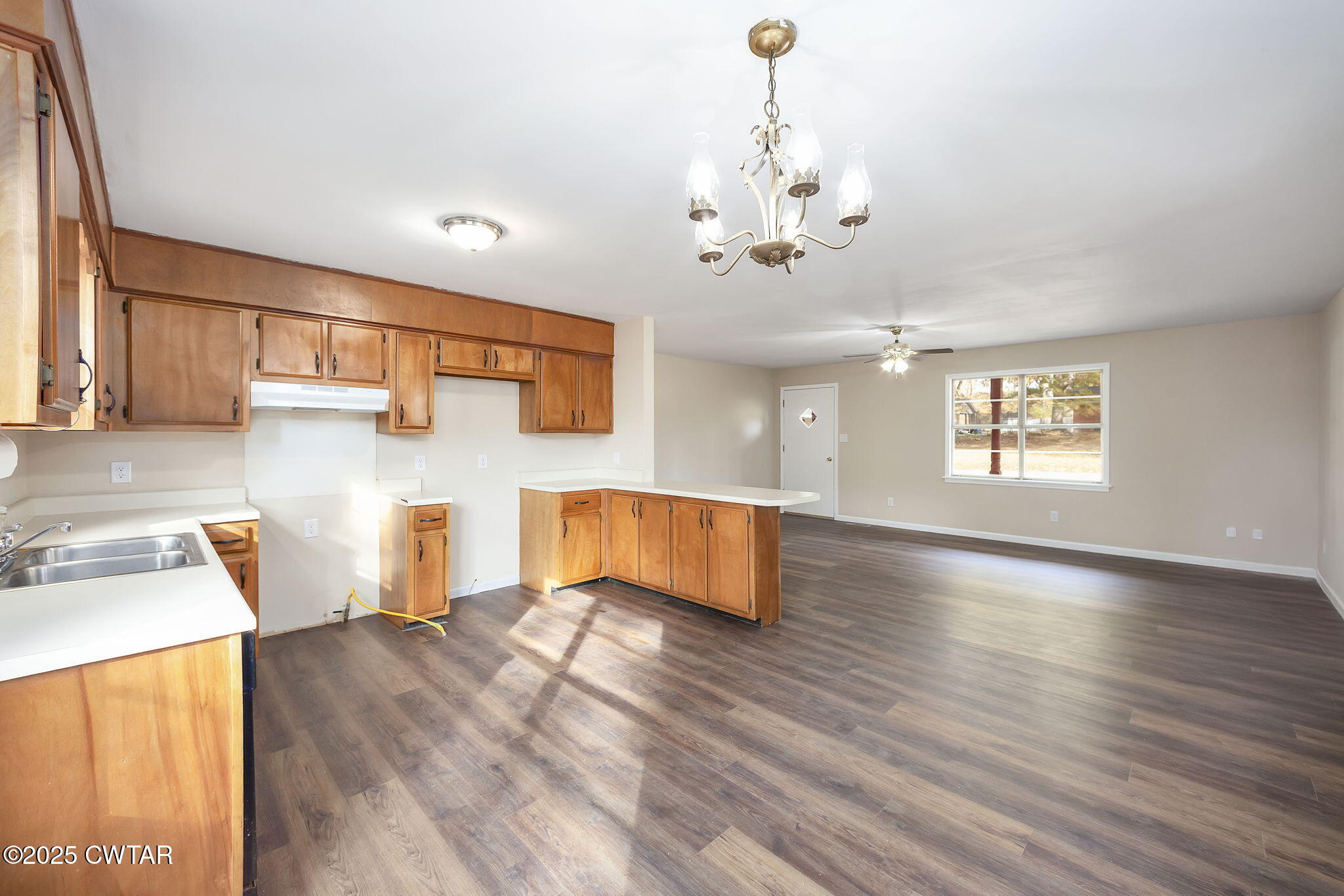 35 Misty Lane Bells, TN 38006 - Photo 4 of 23 a living room with stainless steel appliances granite countertop furniture and a wooden floor