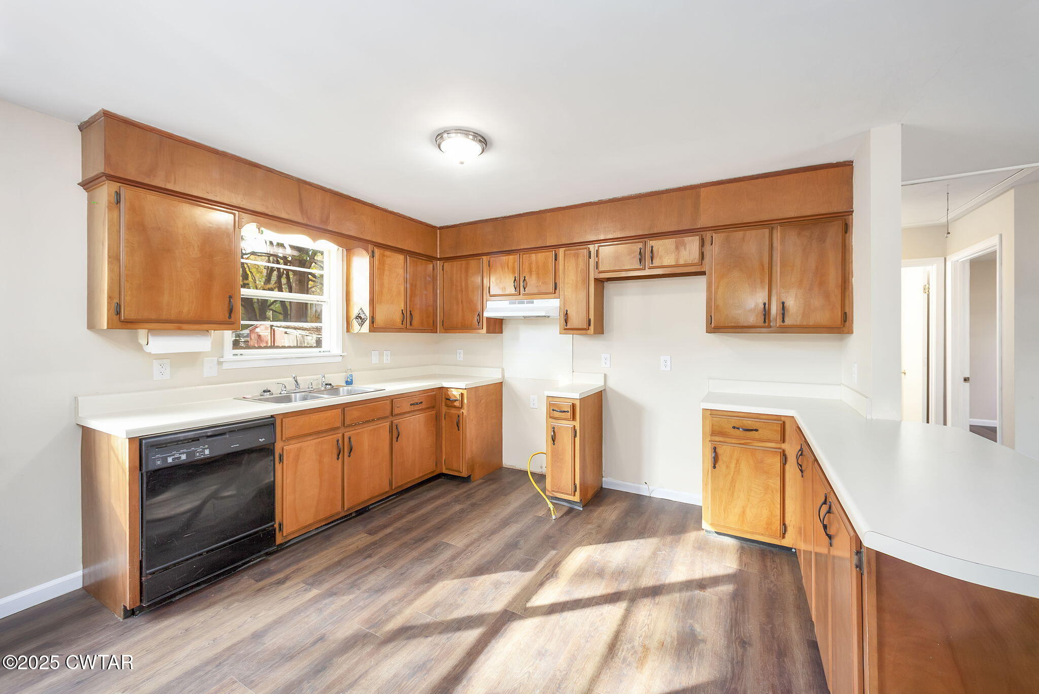 35 Misty Lane Bells, TN 38006 - Photo 5 of 23 a large kitchen with stainless steel appliances granite countertop a sink and wooden cabinets