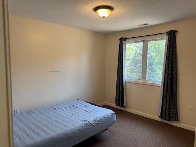 14 Moss Street, Unit 2 Burlington, MA 01803 - Photo 12 of 22 a bedroom with a bed and a window