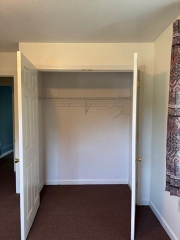 14 Moss Street, Unit 2 Burlington, MA 01803 - Photo 14 of 22 view of room and hallway with wooden floor