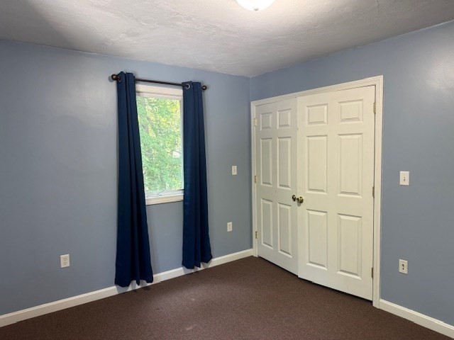 14 Moss Street, Unit 2 Burlington, MA 01803 - Photo 17 of 22 an empty room with windows and closet area