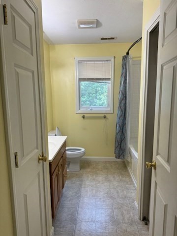 14 Moss Street, Unit 2 Burlington, MA 01803 - Photo 21 of 22 a bathroom with a sink a toilet and a shower