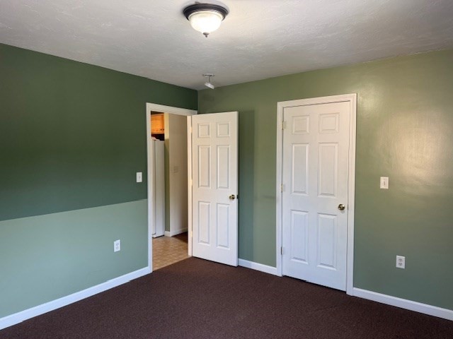 14 Moss Street, Unit 2 Burlington, MA 01803 - Photo 9 of 22 an empty room with closet and windows