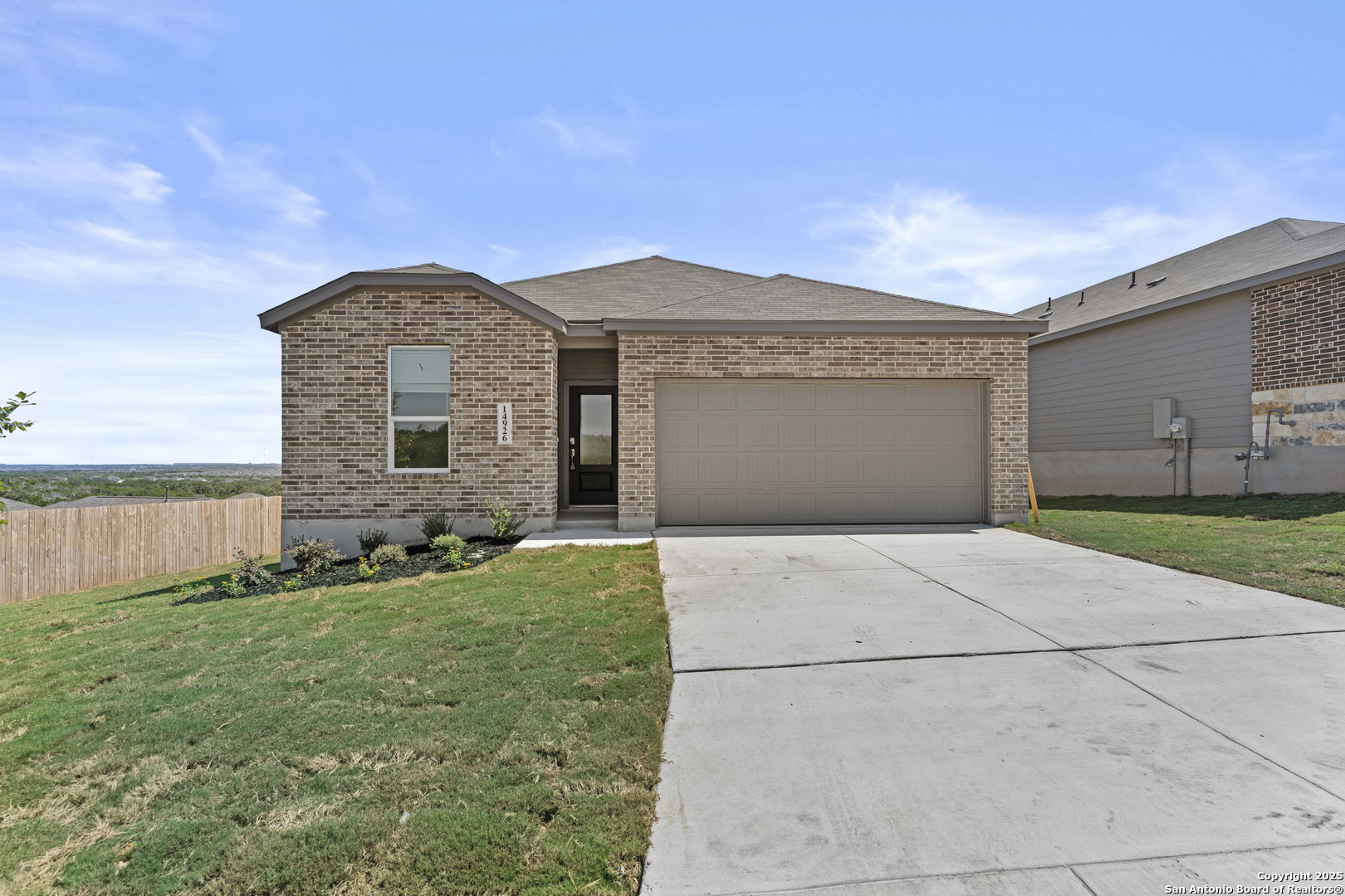 14926 Taradeau San Antonio, TX 78254 - Photo 1 of 25 a front view of a house with a yard