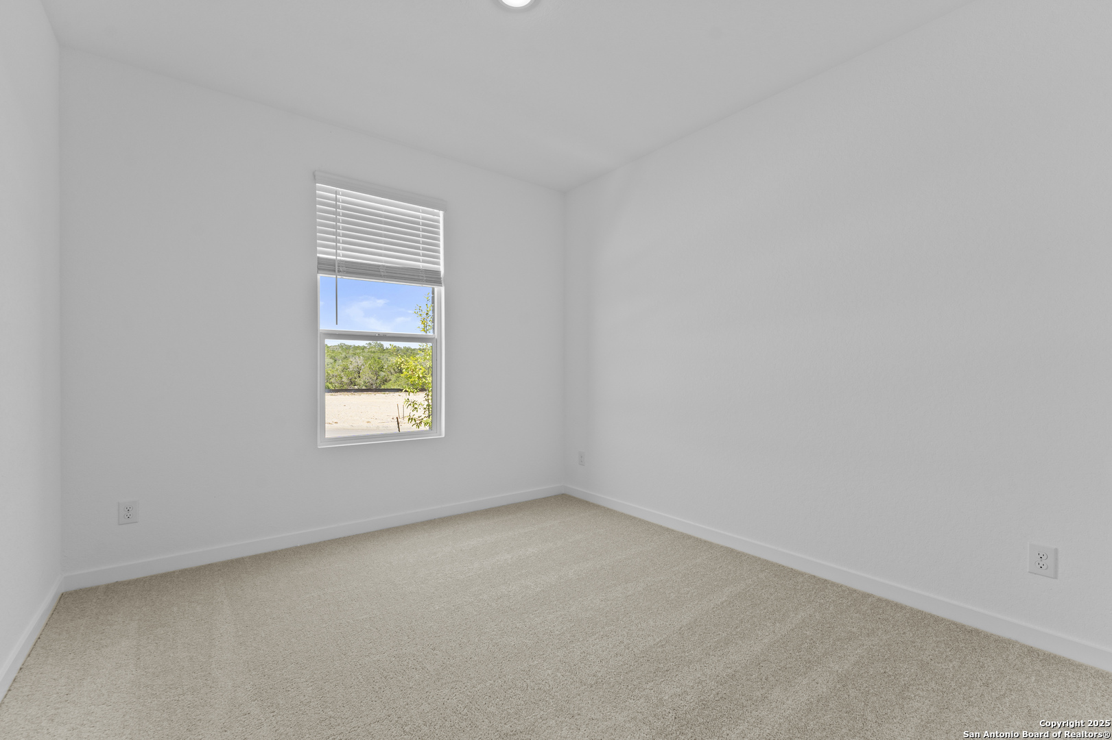 14926 Taradeau San Antonio, TX 78254 - Photo 14 of 25 an empty room with a window