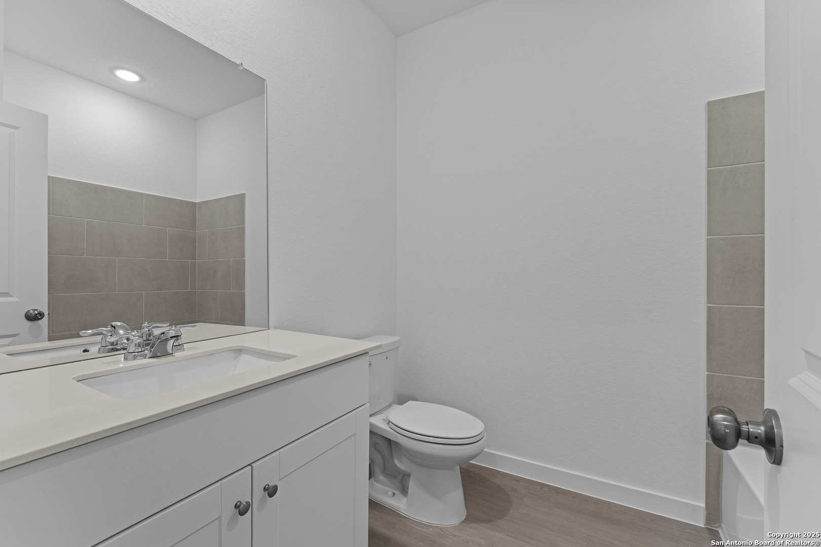 14926 Taradeau San Antonio, TX 78254 - Photo 17 of 25 a bathroom with a sink a toilet and mirror