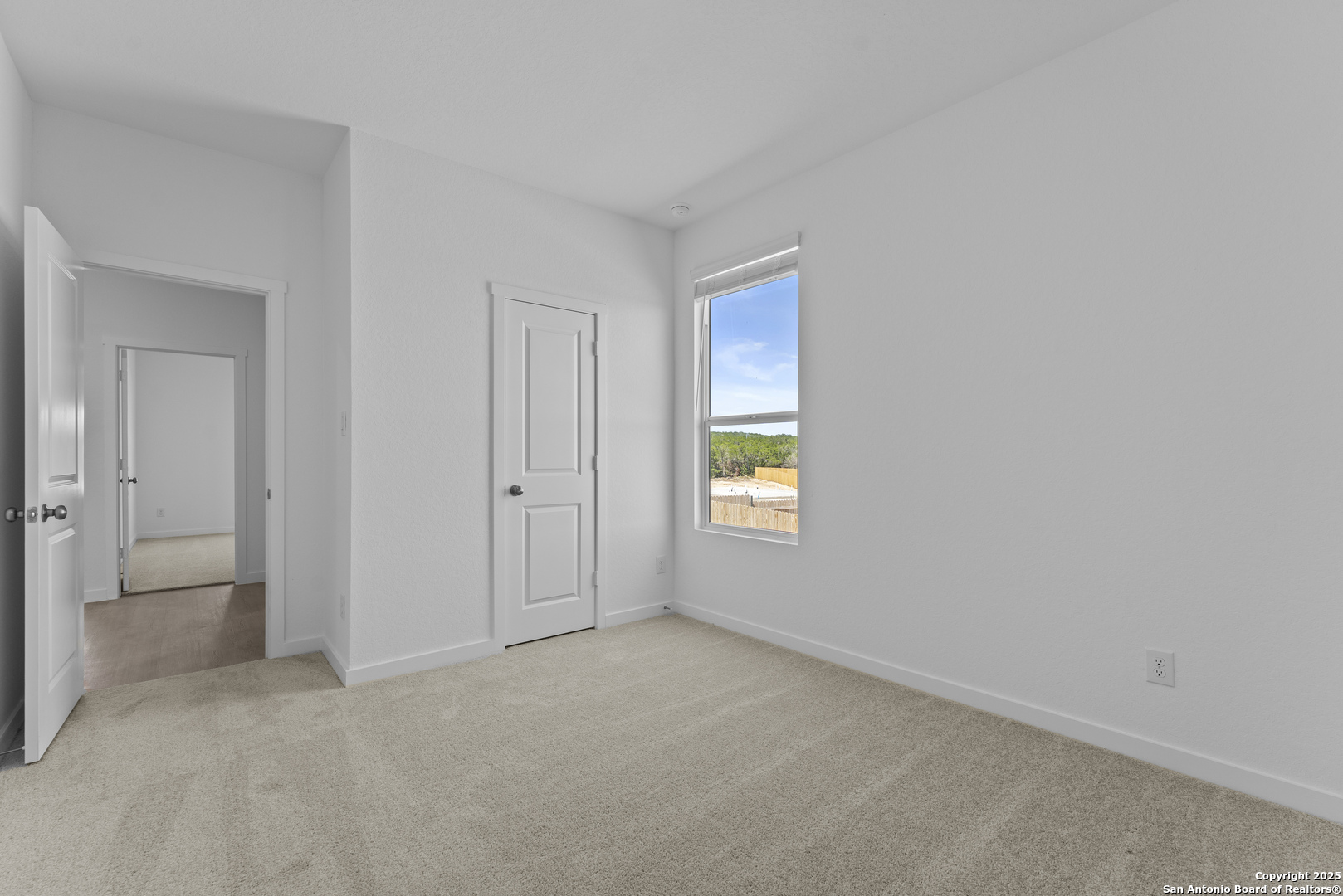 14926 Taradeau San Antonio, TX 78254 - Photo 19 of 25 a view of an empty room and a window