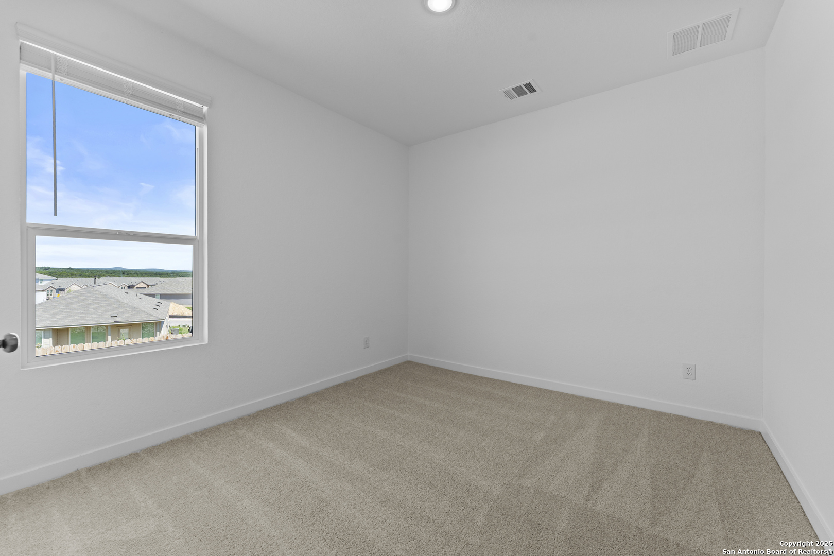 14926 Taradeau San Antonio, TX 78254 - Photo 20 of 25 an empty room with a window