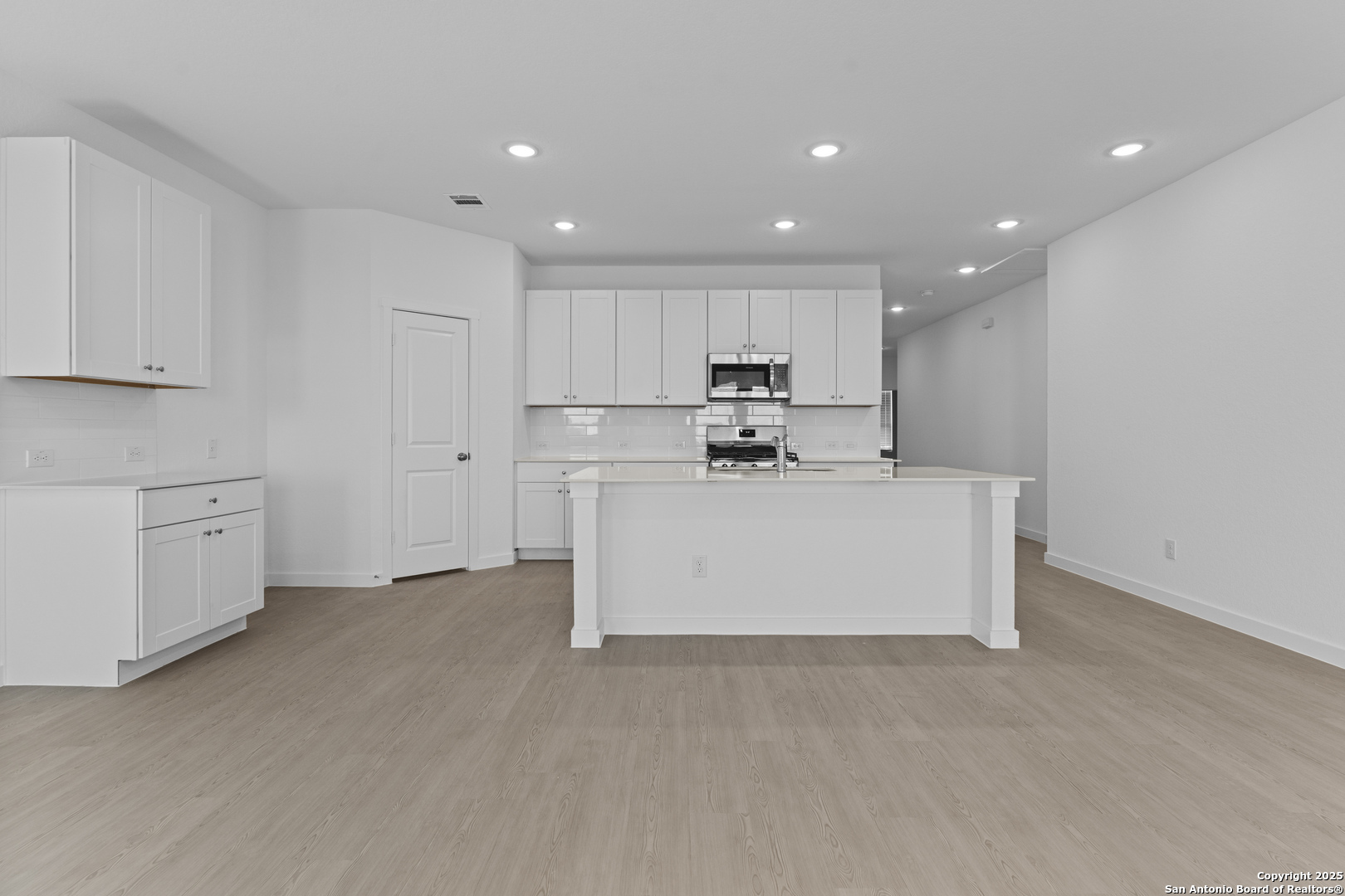 14926 Taradeau San Antonio, TX 78254 - Photo 6 of 25 a view of kitchen with white cabinets