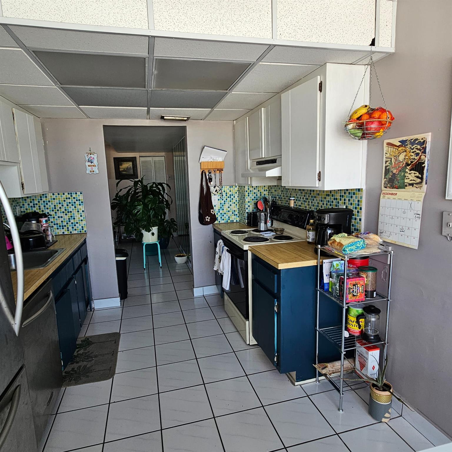 8530 Byron Avenue, Unit 406 Miami Beach, FL 33141 - Photo 16 of 35 a kitchen with stainless steel appliances granite countertop a stove and a refrigerator