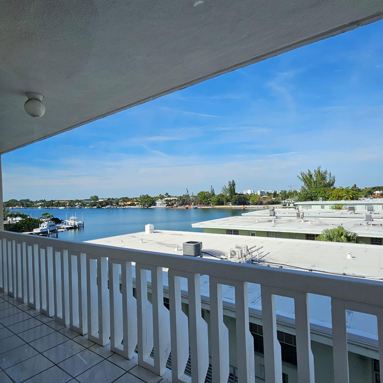 8530 Byron Avenue, Unit 406 Miami Beach, FL 33141 - Photo 17 of 35 a view of city and ocean from a balcony