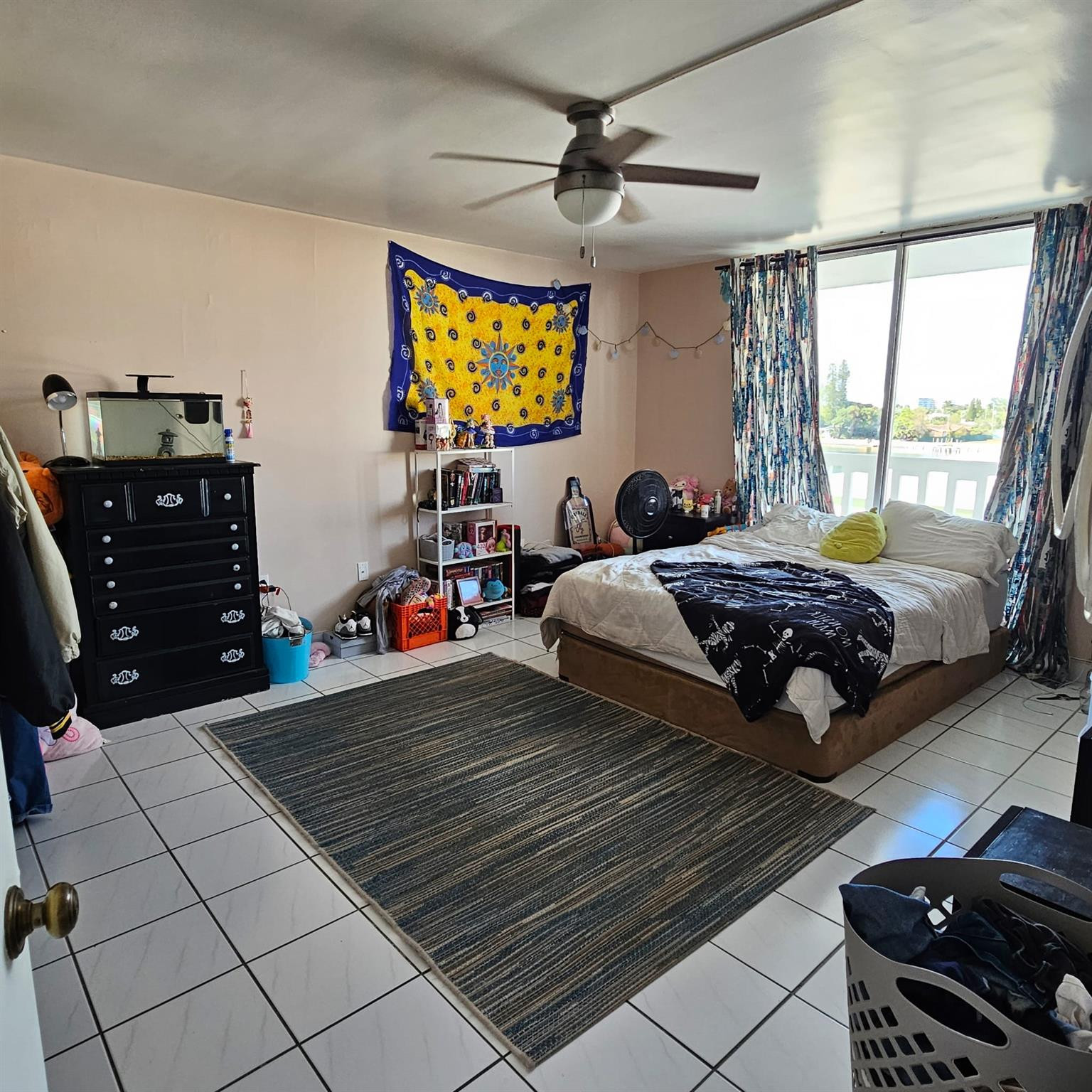 8530 Byron Avenue, Unit 406 Miami Beach, FL 33141 - Photo 22 of 35 a bedroom with a bed and wooden floor