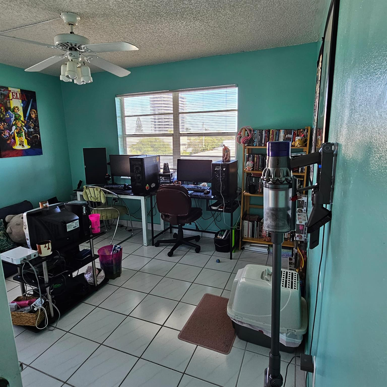 8530 Byron Avenue, Unit 406 Miami Beach, FL 33141 - Photo 23 of 35 a living room with furniture a flat screen tv and a large window