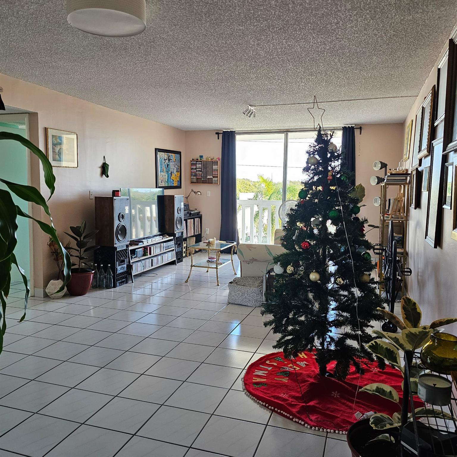 8530 Byron Avenue, Unit 406 Miami Beach, FL 33141 - Photo 25 of 35 a living room with furniture and a potted plant