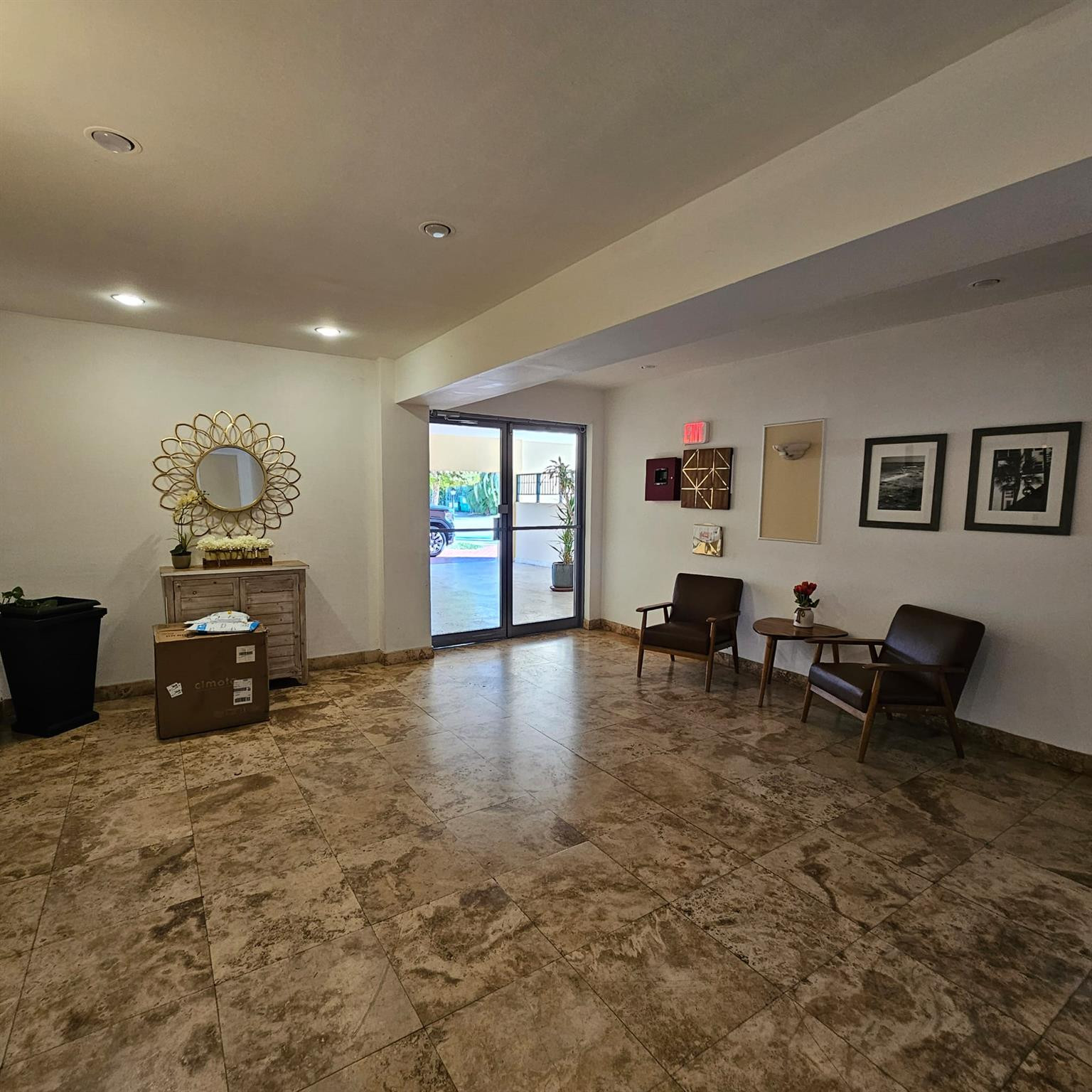 8530 Byron Avenue, Unit 406 Miami Beach, FL 33141 - Photo 29 of 35 a living room with furniture and a dining table