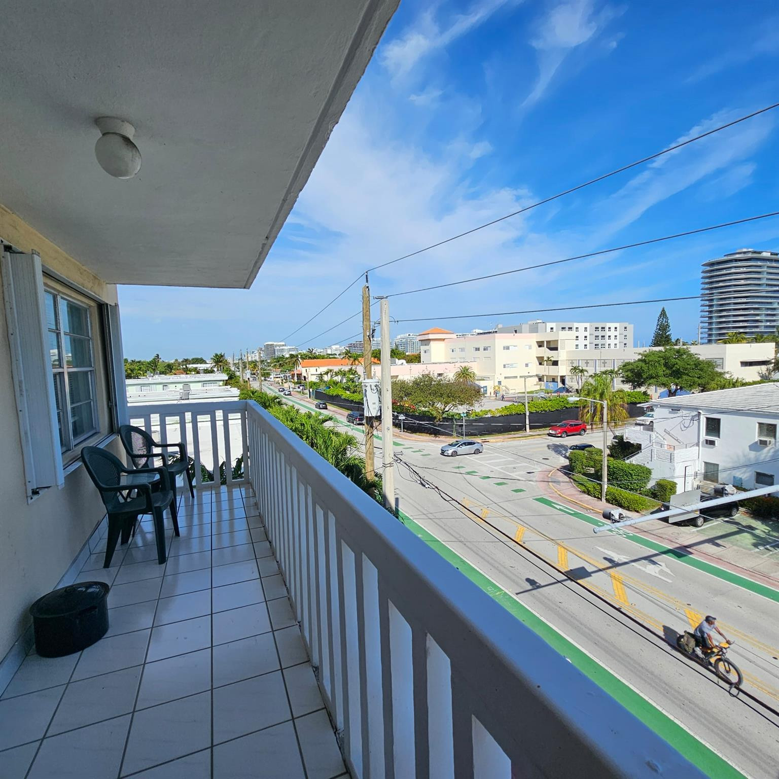 8530 Byron Avenue, Unit 406 Miami Beach, FL 33141 - Photo 33 of 35 a view of a patio with a table and chairs