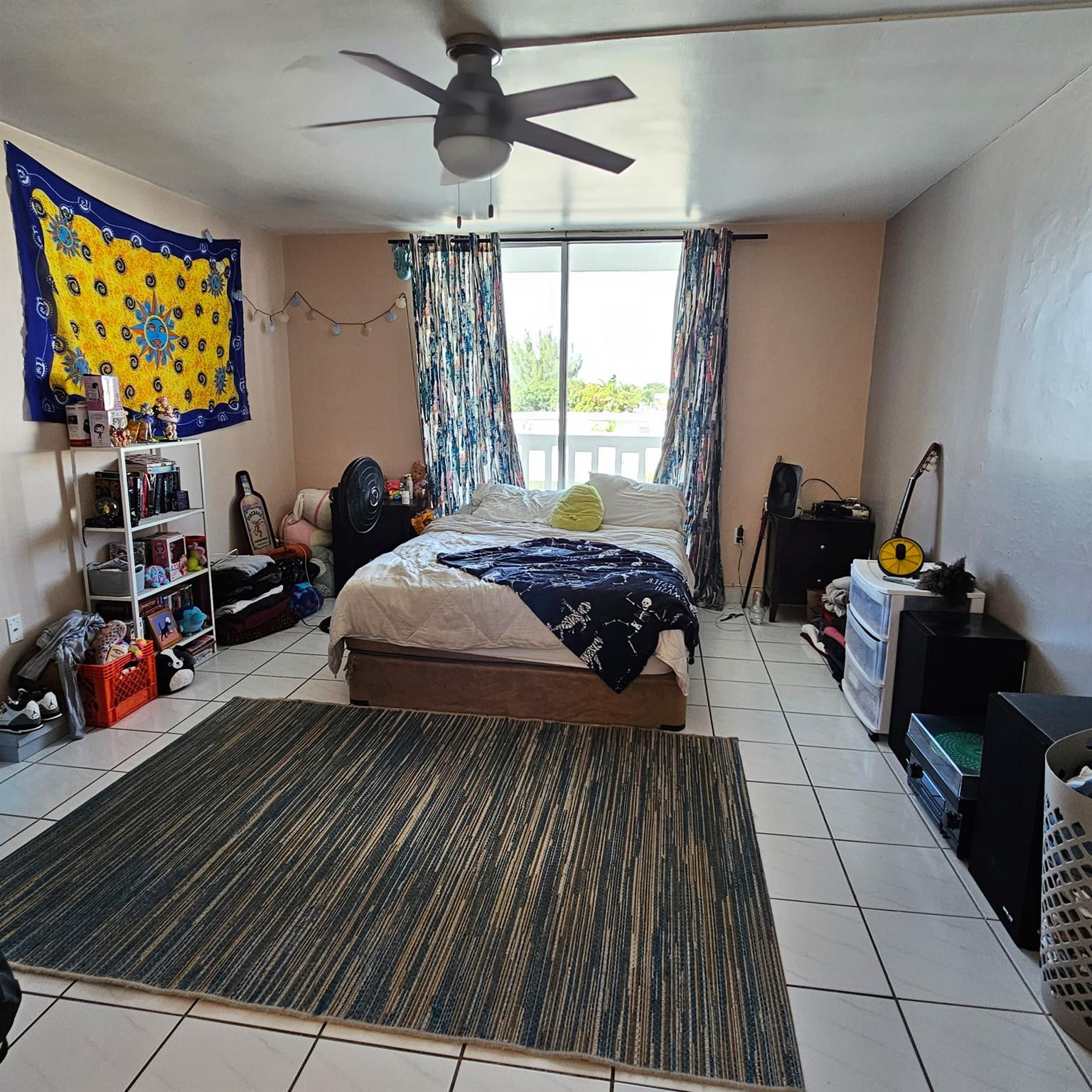 8530 Byron Avenue, Unit 406 Miami Beach, FL 33141 - Photo 5 of 35 a bed room with two beds and a flat screen tv
