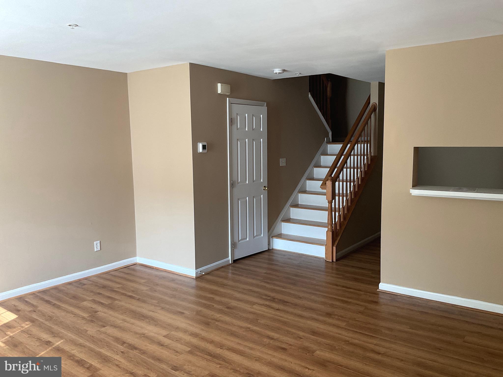 2152 Bristol Drive, Unit 4 Frederick, MD 21702 - Photo 3 of 12 a view of a livingroom with wooden floor