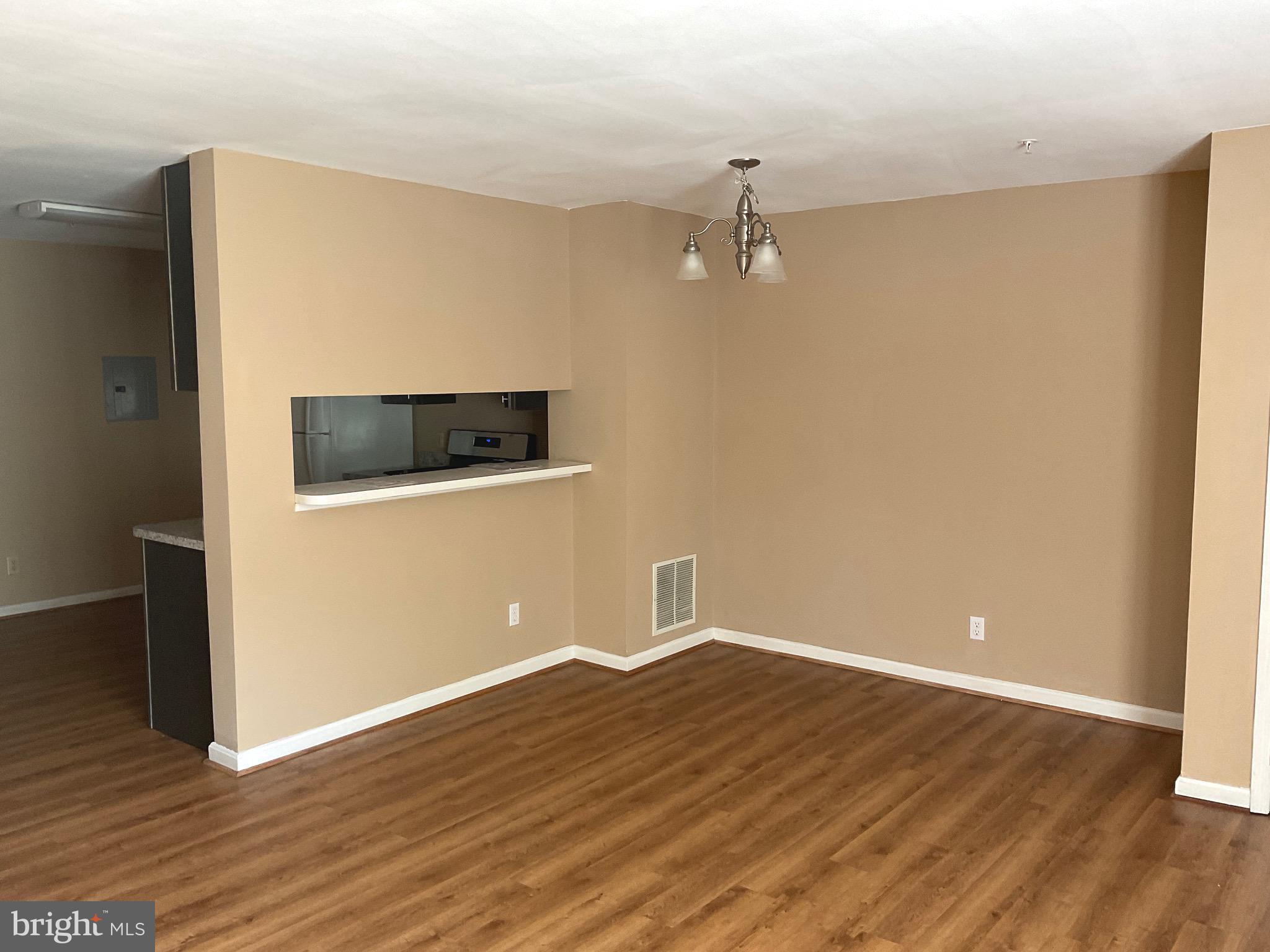 2152 Bristol Drive, Unit 4 Frederick, MD 21702 - Photo 4 of 12 wooden floor in an empty room