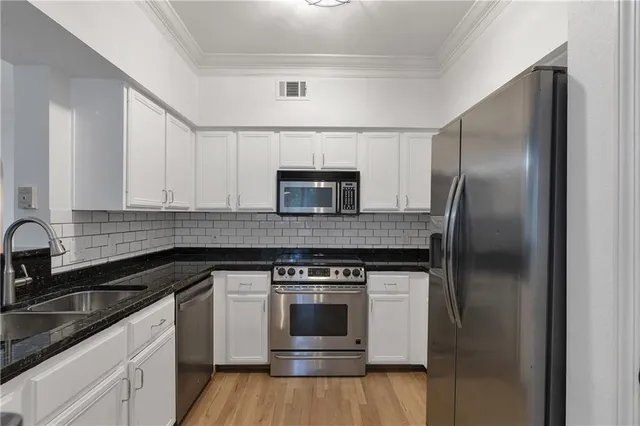 a kitchen with a stove and a microwave