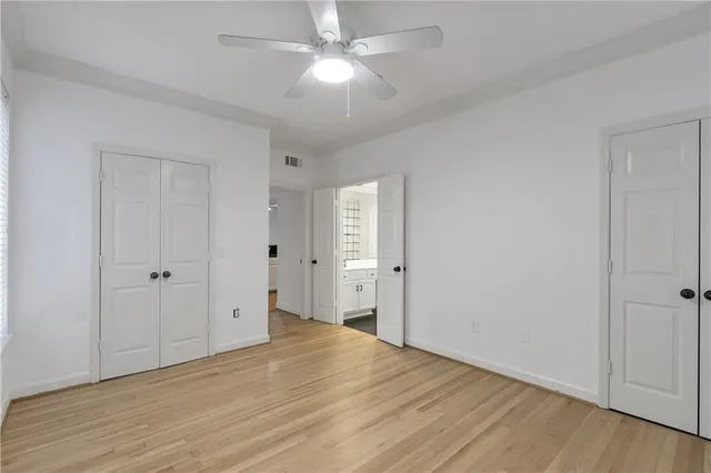 a bathroom with a double vanity sink mirror and shower