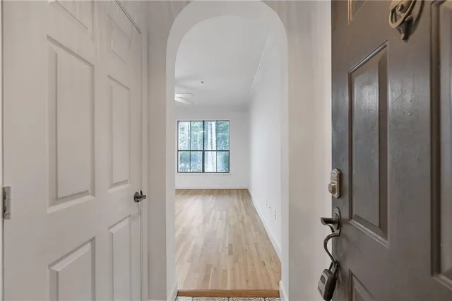 a view of an empty room with windows