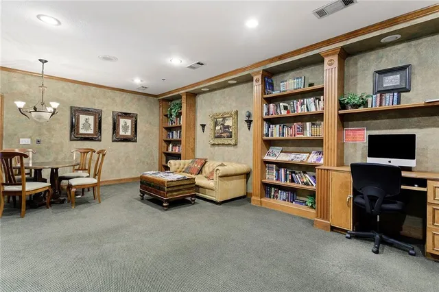a room with furniture pool table and windows