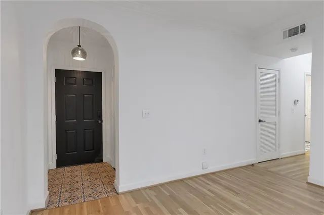 a view of hallway with wooden floor