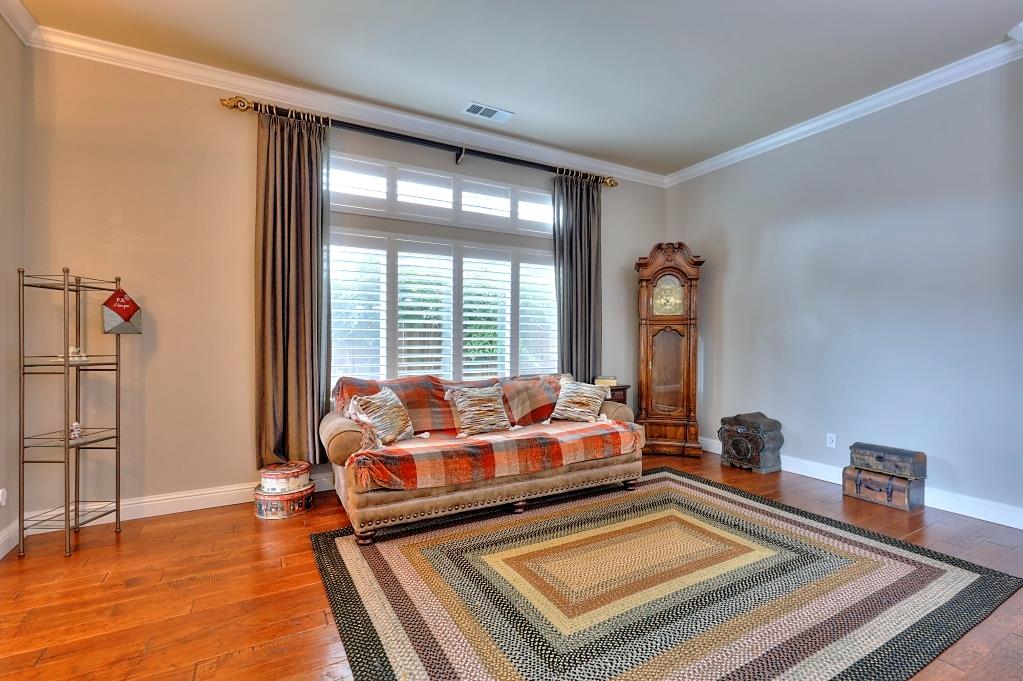 4152 Post Oak Drive Turlock, CA 95382 - Photo 13 of 71 a living room with furniture fireplace and wooden floor
