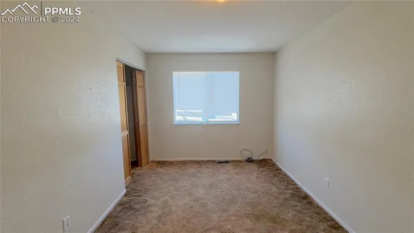 an empty room with closet
