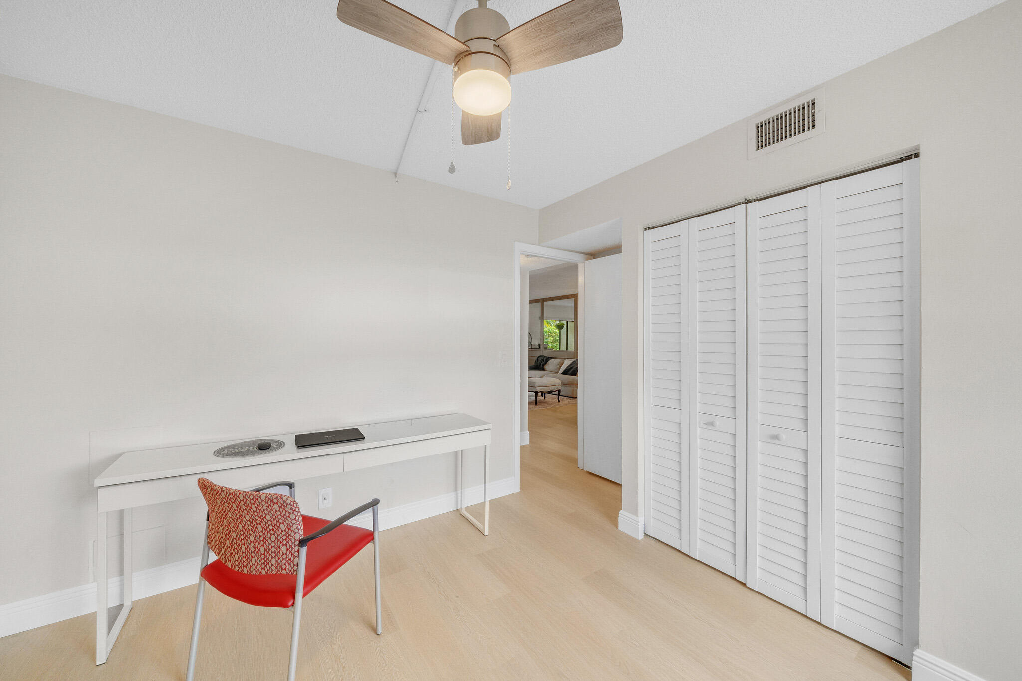 22136 Palms Way, Unit 103 Boca Raton, FL 33433 - Photo 33 of 42 a living room with furniture and a ceiling fan