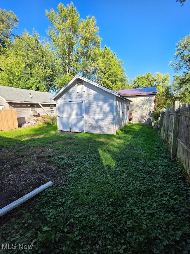 1445 Hubbard Road Madison, OH 44057 - Photo 5 of 21 Rear view of house featuring concrete block siding