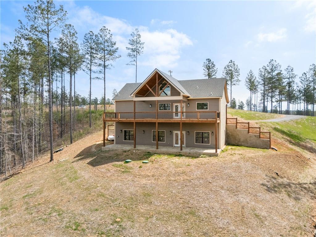 2956 Blalock Mountain Road Talking Rock, GA 30175 - Photo 45 of 65 a front view of a house with a yard table and chairs