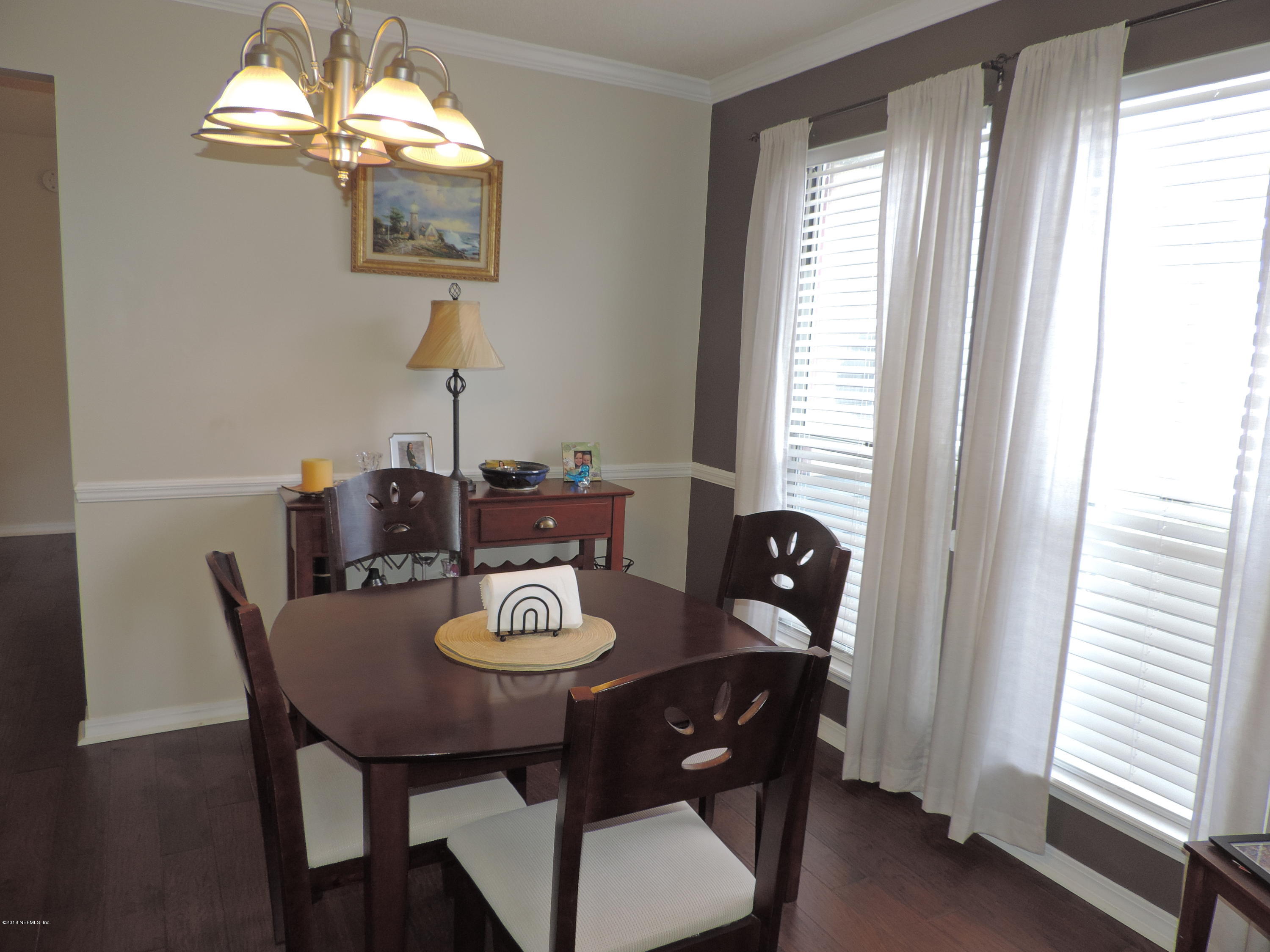 7024 St Augustine Road Jacksonville, FL 32217 - Photo 12 of 34 a view of a dining room with furniture window and outside view