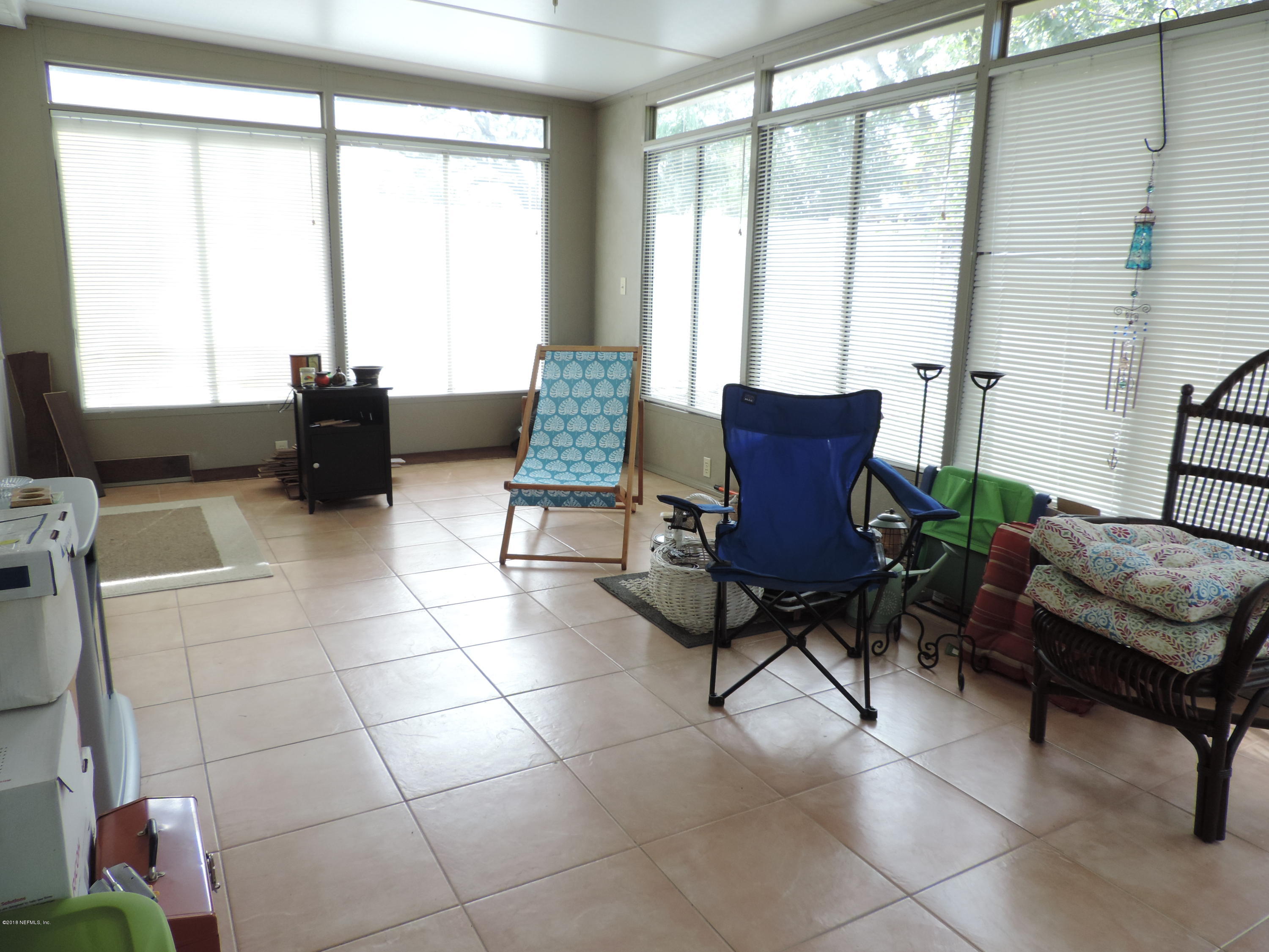 7024 St Augustine Road Jacksonville, FL 32217 - Photo 13 of 34 a living room with furniture and a window