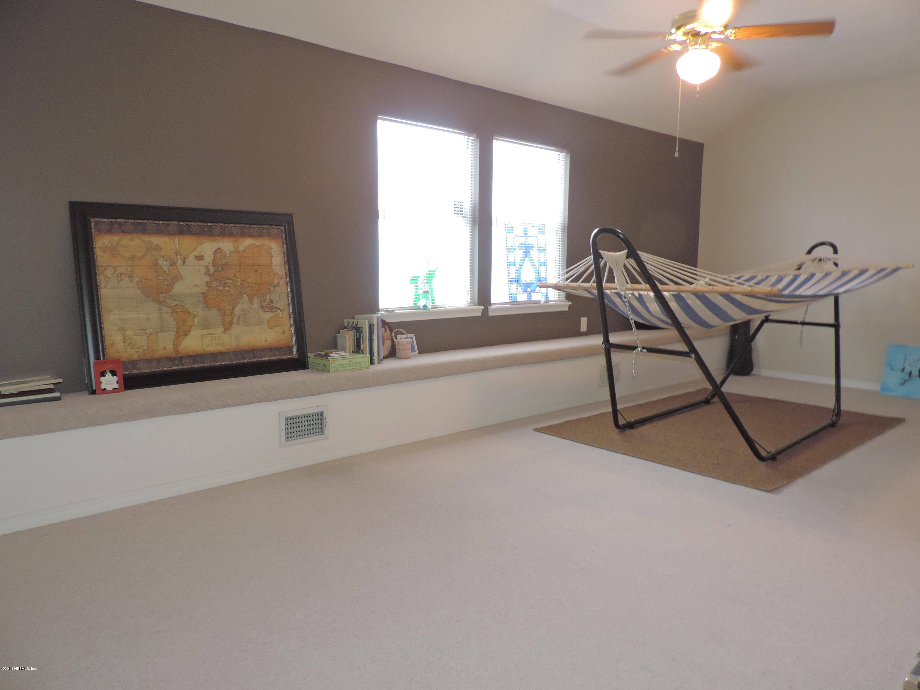 7024 St Augustine Road Jacksonville, FL 32217 - Photo 20 of 34 a living room with furniture and a large window